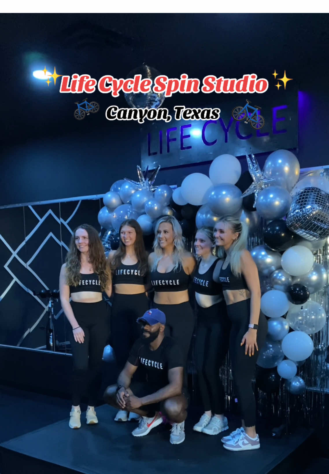 Grand opening team under LIFE CYCLE neon