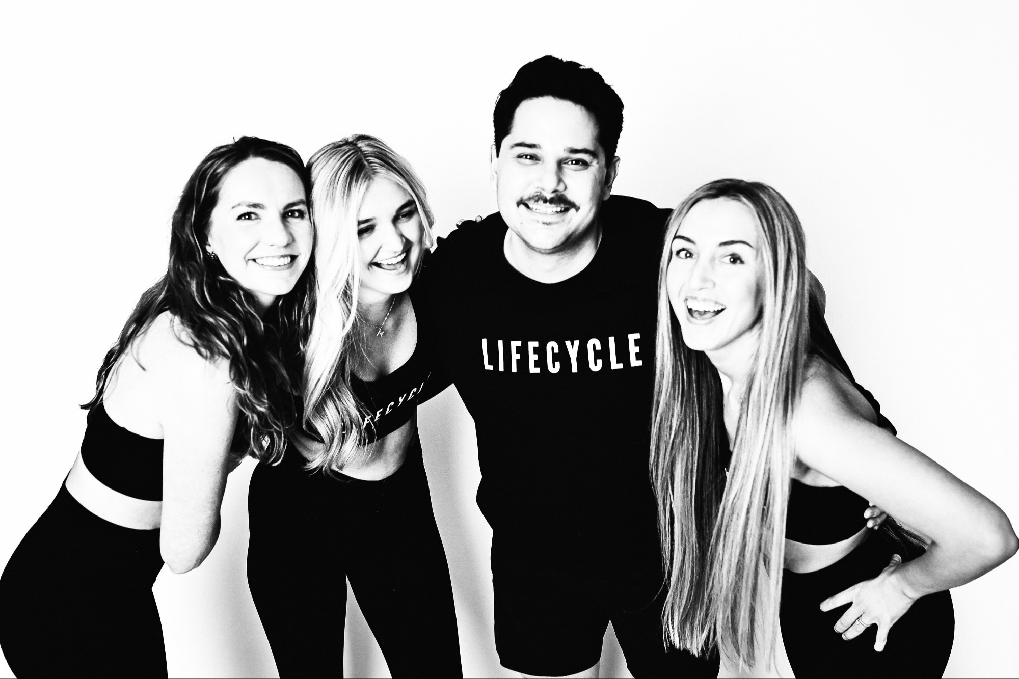 LIFE CYCLE instructors in studio merch